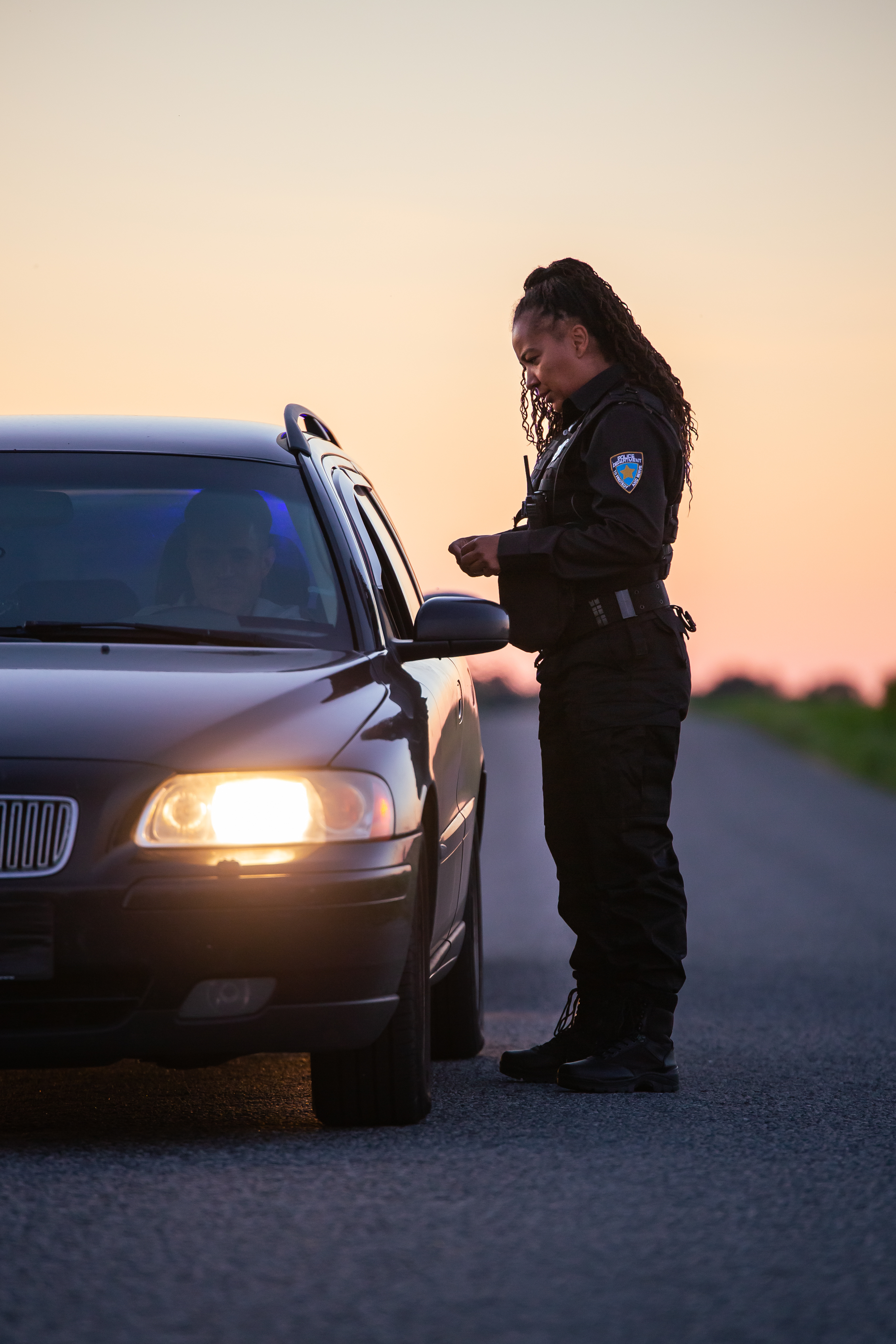 A drunk driver being pulled over - contact Branson West Law today to work with a DUI defense lawyer in Utah.