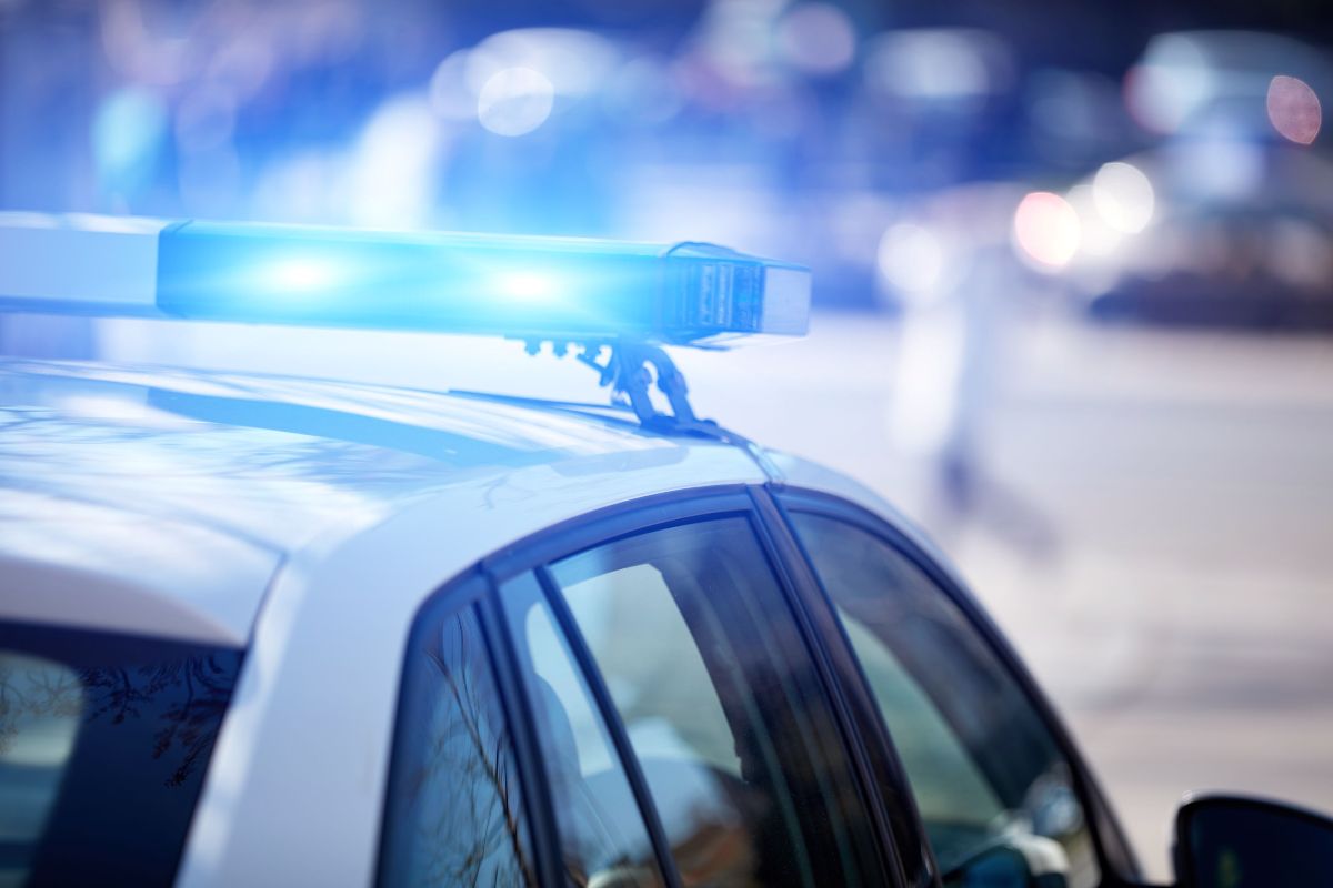 Cop cars with flashing lights like these are not usually a good sight behind your car - call Branson West Law today for help with your charges.