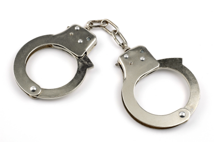 An image of handcuffs - if you are facing criminal charges, contact Branson West Law for an expert criminal mischief lawyer in Utah.
