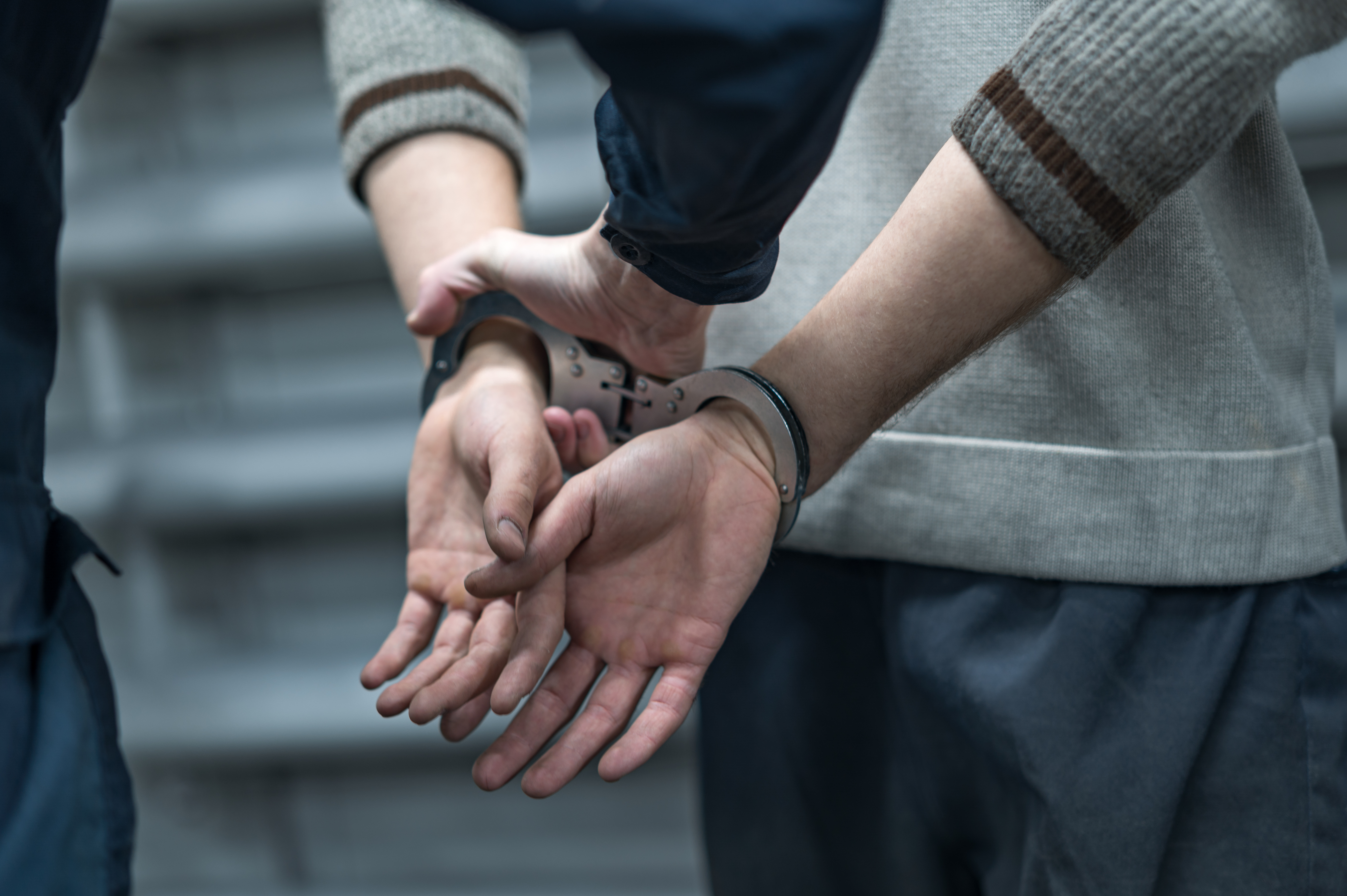 A person getting arrested on a shoplifting charge - if you are retail theft charges, contact Branson West Law in Utah.